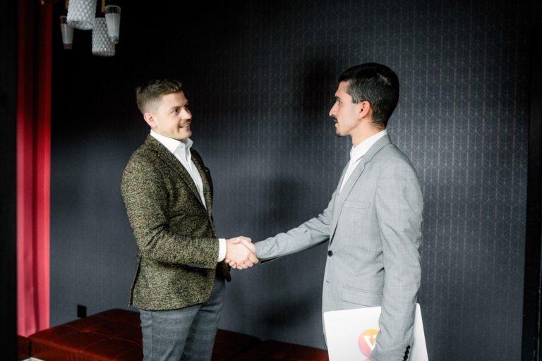 Consultant and client handshake